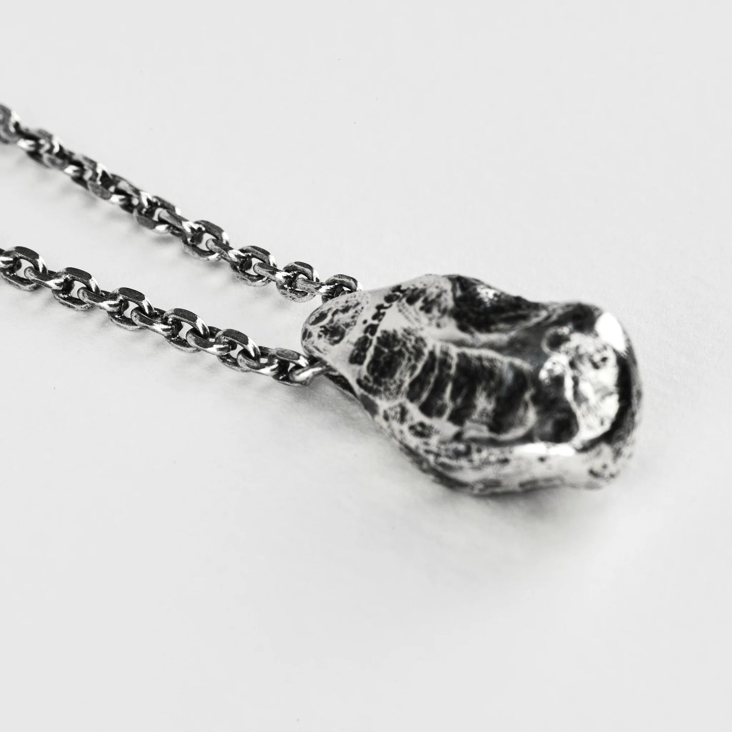 THE STONE NECKLACE