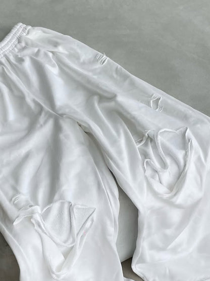 RIPPED PANTS WITH ELASTIC BOTTOM